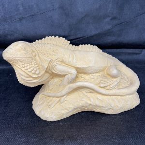 garden ornament lying iguana left